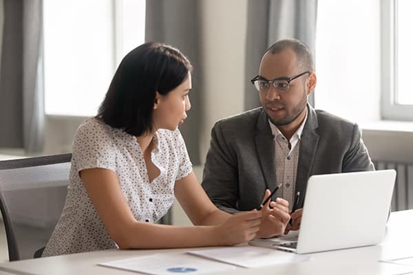 Woman & man at laptop